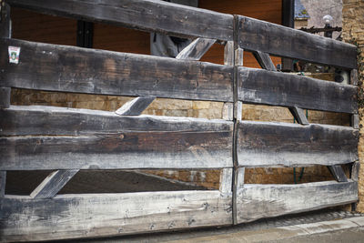 Wooden gate to the countryside. the fence on the farm. the construction of the boards. 