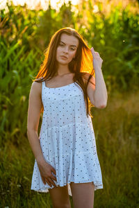 Young woman standing on field