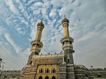 Low angle view of statue against cloudy sky