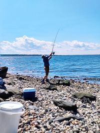 Man fishing on beach