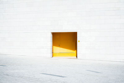 Closed yellow door of building