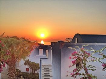 Sun shining through house at sunset