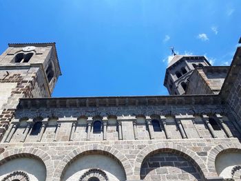 Low angle view of historical building against blue sky