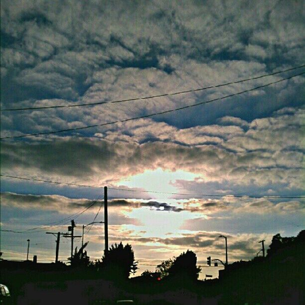 sky, cloud - sky, power line, cloudy, electricity pylon, silhouette, low angle view, power supply, sunset, electricity, cable, weather, cloud, connection, built structure, tree, overcast, fuel and power generation, building exterior, nature