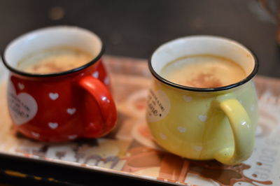 Close-up of coffee cup on table