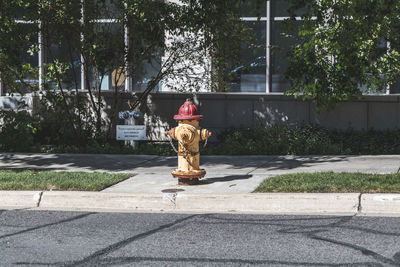 Red and yellow fire hydrant on the street in the usa.