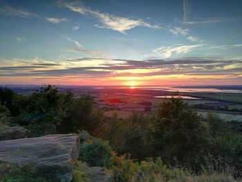 Scenic view of landscape against sky during sunset