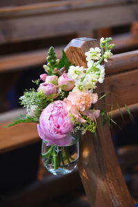 Pretty pink and peach bridal arrangement in church