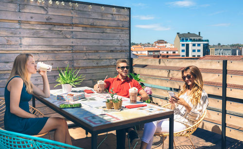 Male and female friends enjoying in cafe