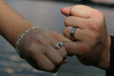 Close-up of hands with engagement ring