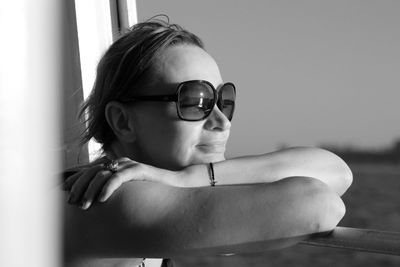 Portrait of boy wearing sunglasses sitting outdoors