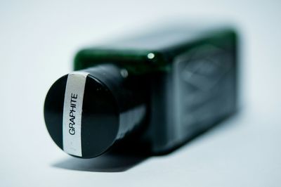 Close-up of camera on white background