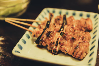 Close-up of meat skewers in plate