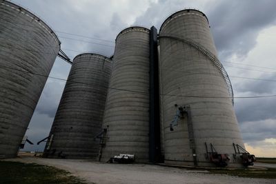 Low angle view of factory against sky