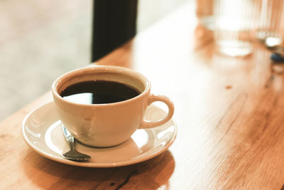 Close-up of coffee cup on table