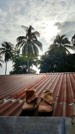Houses against cloudy sky