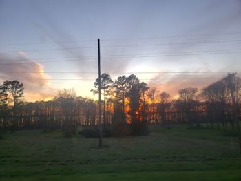 Scenic view of field against sky during sunset