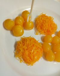 High angle view of orange fruits in plate