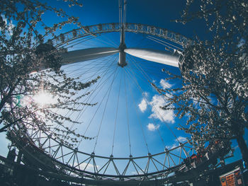 Low angle view of ferris wheel against sky