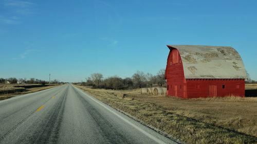 Empty road along landscape