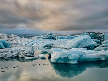 Scenic view of frozen sea against sky