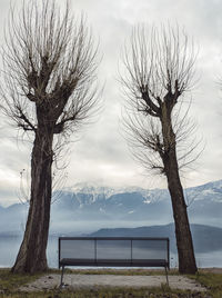 Bench on the lakeside of lake como in winter season