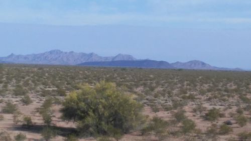 Scenic view of mountains against clear blue sky