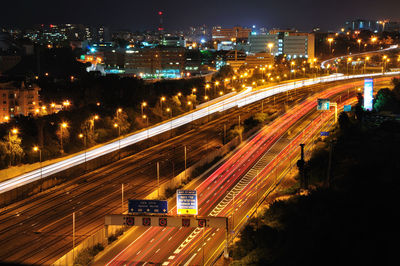 High angle view of light trails on city street at night