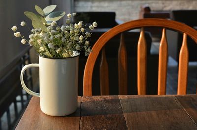 Lily-of-the-valley in mug on table