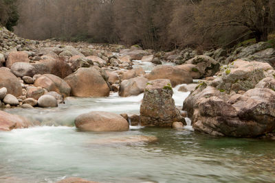 Scenic view of waterfall in sea