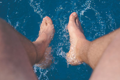 Low section of woman in swimming pool