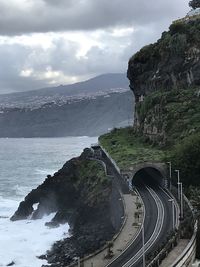 High angle view of road by sea against sky