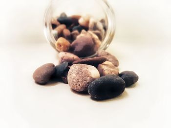 Close-up of blueberries in glass jar on table