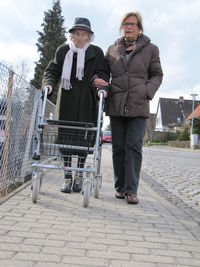 Portrait of people on sidewalk