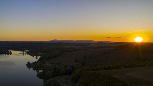 Scenic view of landscape against sky during sunset