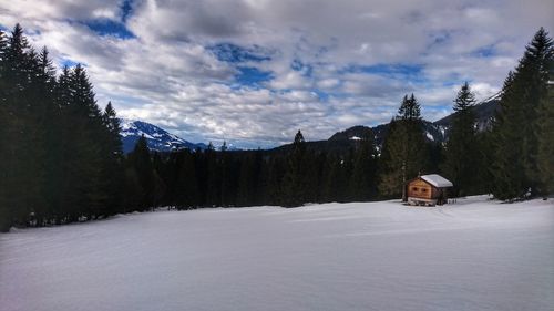 Scenic view of snowcapped mountains against sky during winter