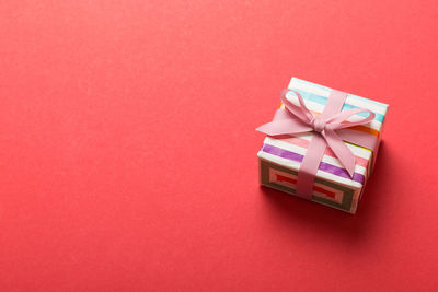 High angle view of gift box on yellow background