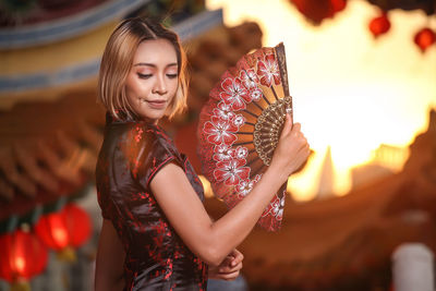 Young woman holding camera