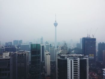 View of cityscape during foggy weather