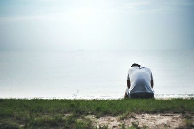 Rear view of man on field