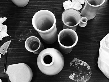 Directly above shot of coffee cup on wooden table