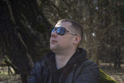 Portrait of young man in forest