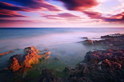 Scenic view of sea against sky during sunset