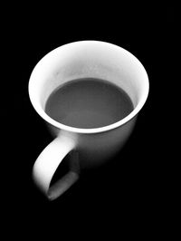 Close-up of black coffee over white background