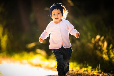 Cute girl running at park