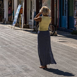 Rear view of woman with umbrella