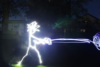 Light painting against sky at night