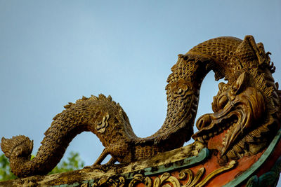 Low angle view of a statue against clear sky