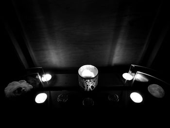 Low angle view of illuminated lamp in ceiling