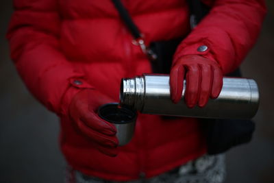 Pouring a cup of tea in winter outside 